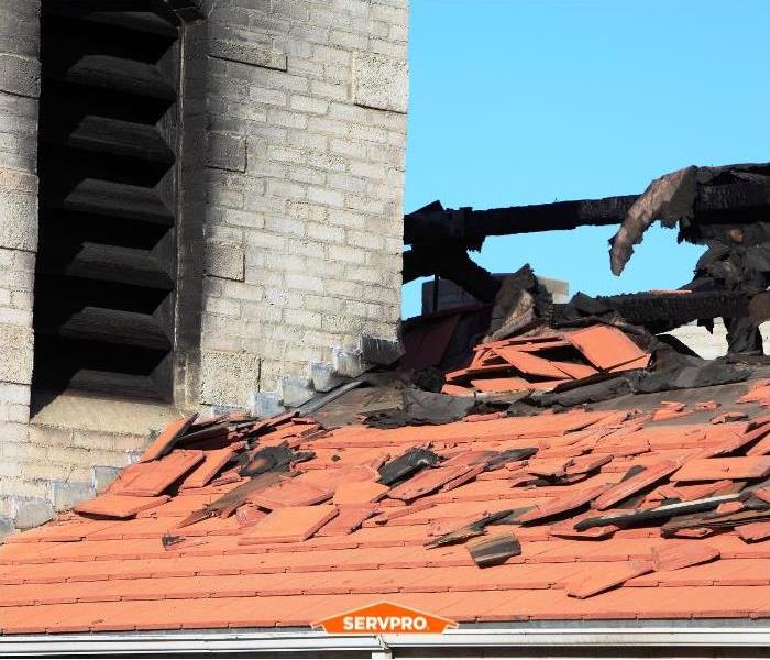 Smoke damage to a roof after a fire.